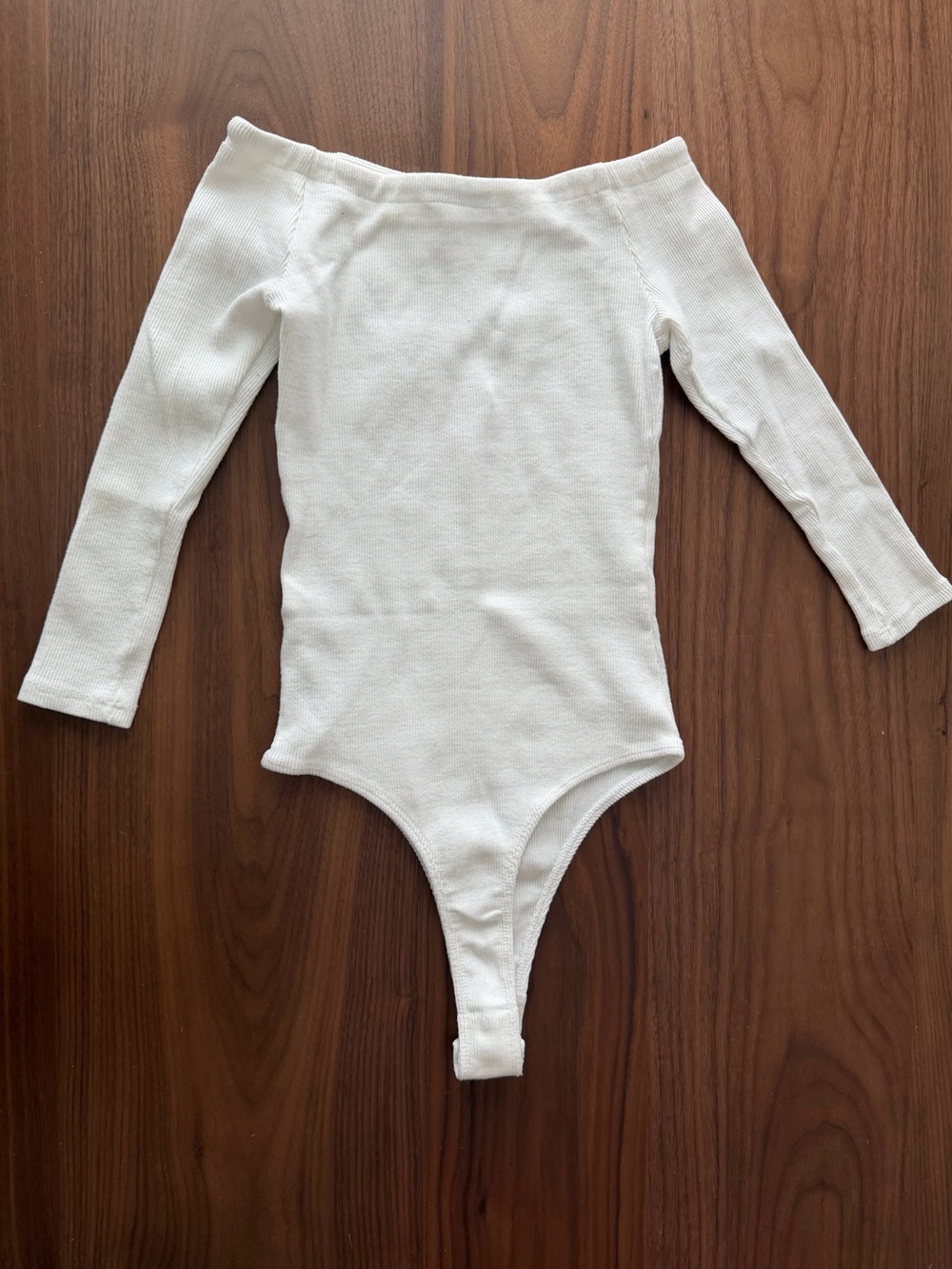 Fashion Nova. ' White Long-Sleeve Ribbed One-Piece Bodysuit